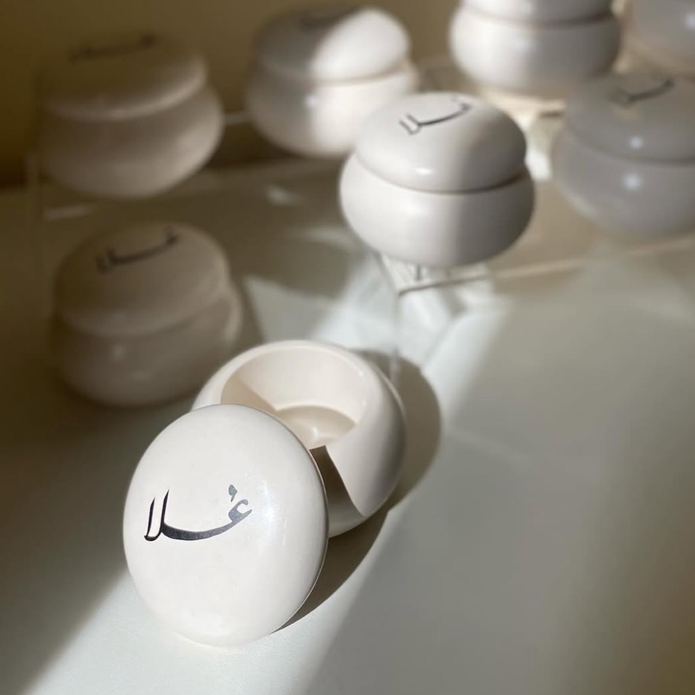 White Round Containers with Black Script